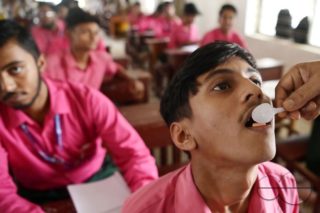 A student of Netaji Subhash Vidyaniketan High School is taking a deworming tablet during the special program "Mukhyamantri Sustho Shoishob, Sustho Kaishore Abhiyan (MSSSKA 7.0)" in Agartala