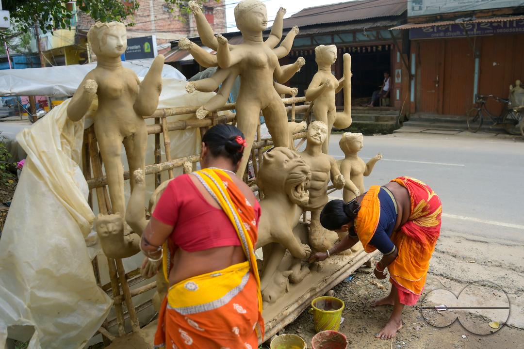 Idol makers adding finishing touches to an idol of the Mother Goddess Durga in a studio, ahead of the Durga Puja festival in Agartala, Tripura, India.
