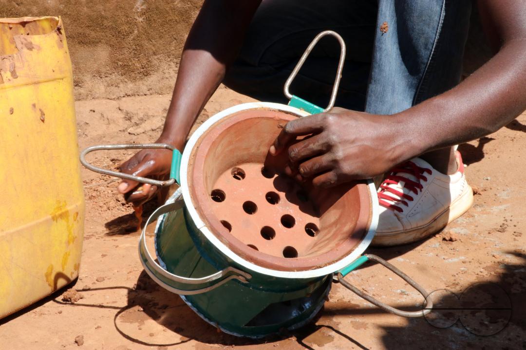 A man is seen making a charcoal stove, locally known as 'mbaula,' in Mtandile township, Lilongwe,