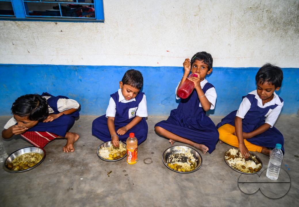 The mid-day meal scheme is a school meal program of the Government of India designed to better the nutritional standing of school-age children nationwide