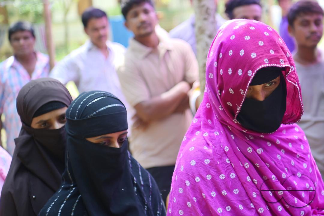 Muslim voters patiently await their turn to cast their votes at a Boxanagar polling station in Agartala in the first phase of Lok Sabha elections