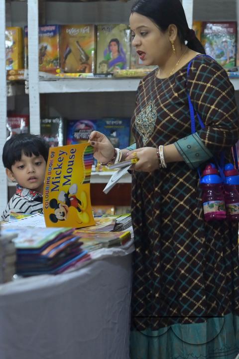 People looking at books in a book stall at the 42nd Agartala Book fair International Fair Ground, Hapania at Agartala