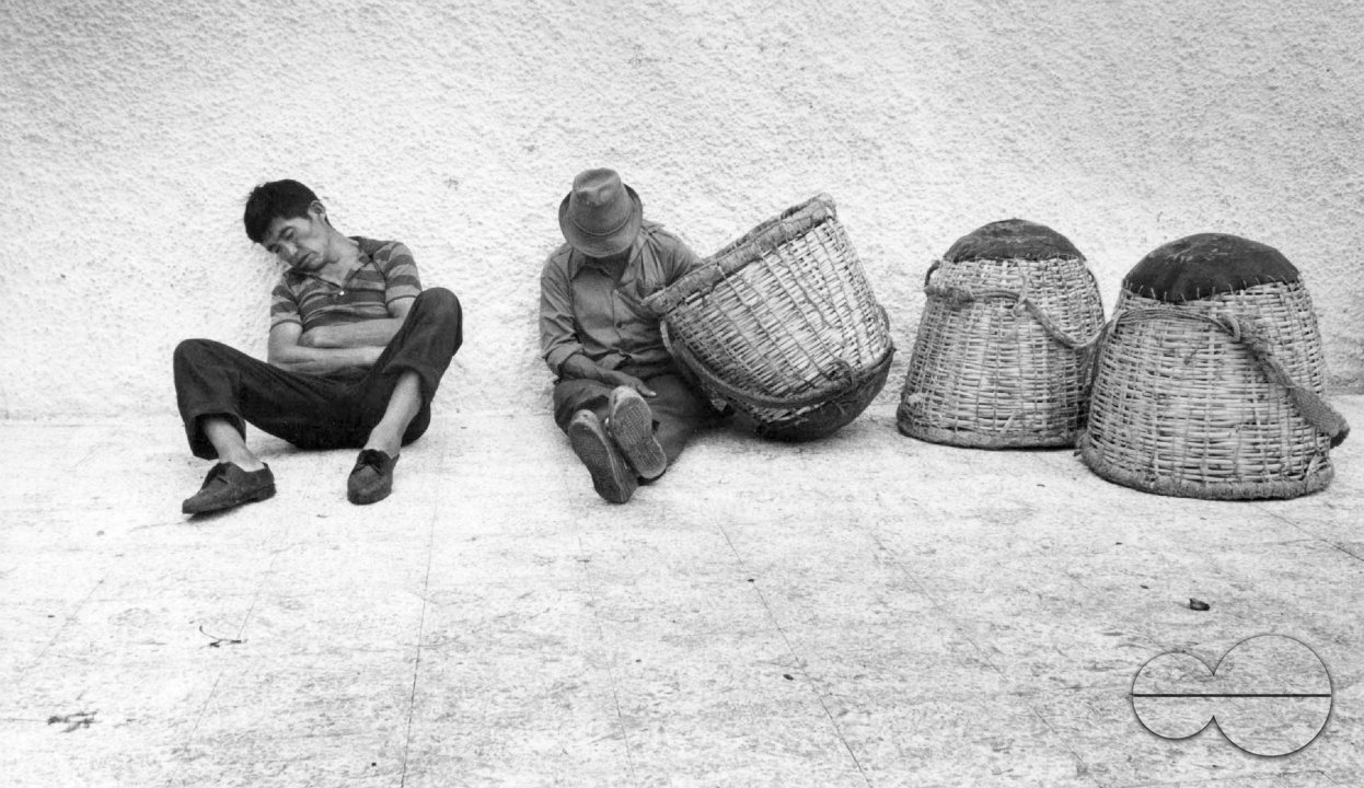ECUADOR FISHERMEN RESTING AFTER A LONG NIGHT SHIFT, GUAYAQUIL 1990