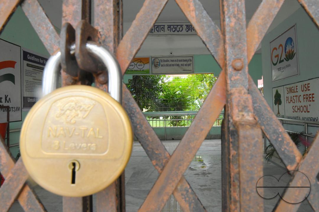 A locked gate of a government school during cyclone MidhiliÂ in Agartala