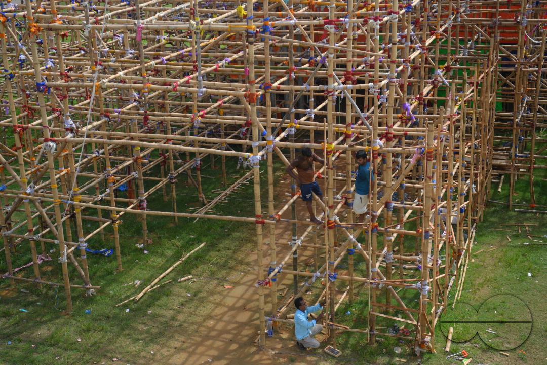 Workers are making a temporary bamboo structure, locally called "Pandal", for the upcoming Durga Puja in Agartala