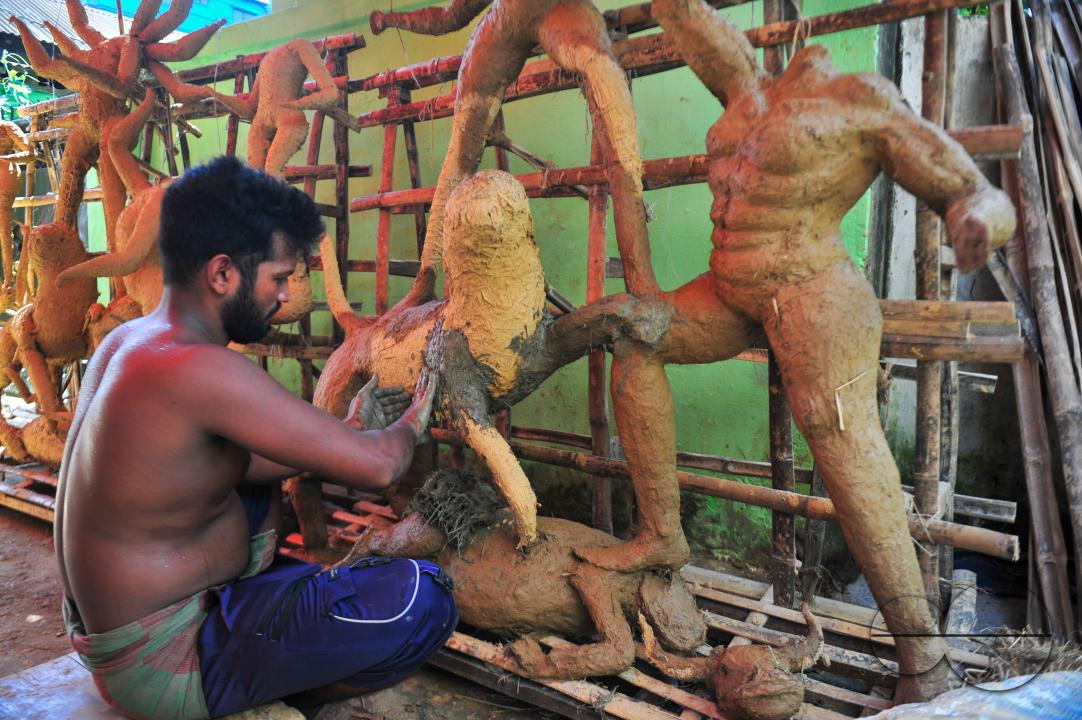 Nondi Pal, an idol artist is working on structures of Hindu Deity in preparation for the upcoming Durga Puja Festival 2023