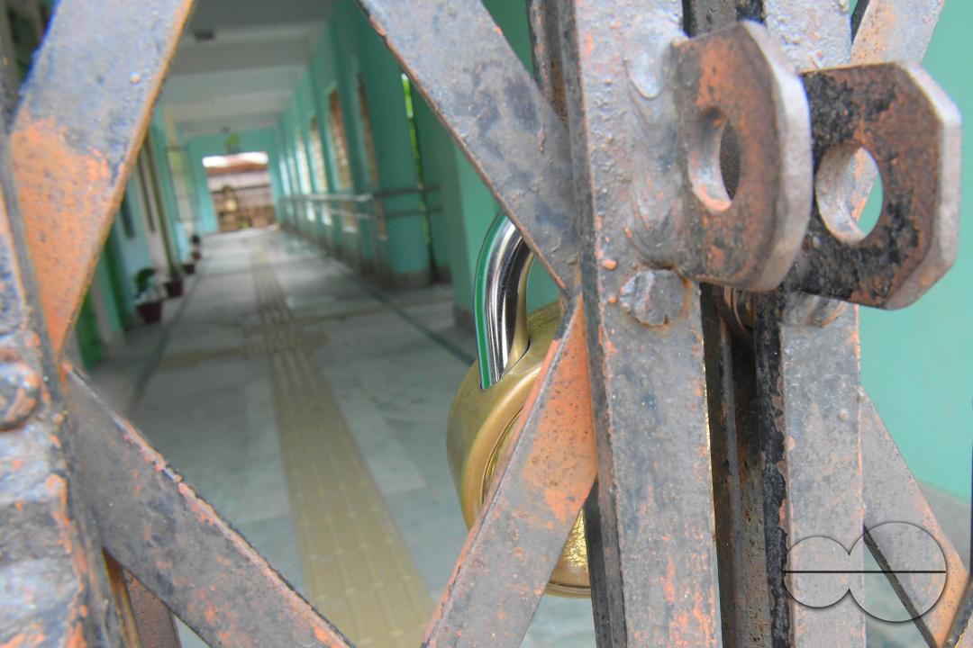 A locked gate of a government school during cyclone MidhiliÂ in Agartala