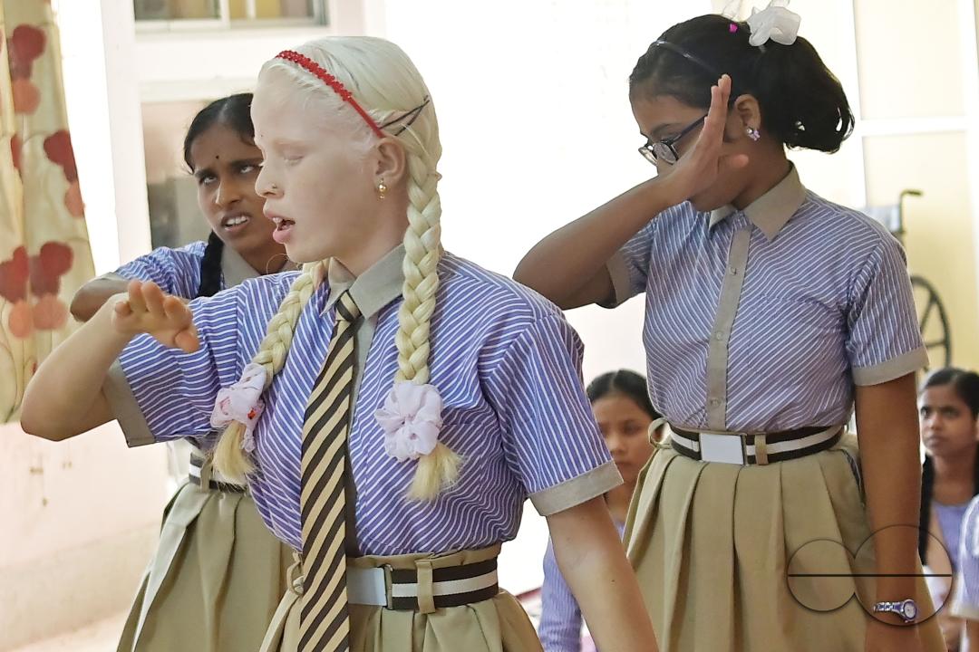 Students at the Institute for Visually Handicapped are performing a dance during the 'Children's Day' celebration at the institute's campus in Narsingarh, in Agartala