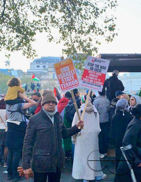Thousands of protestors raise voices, carry placards and show their support for Palestinians, at Trafalgar Square, central London