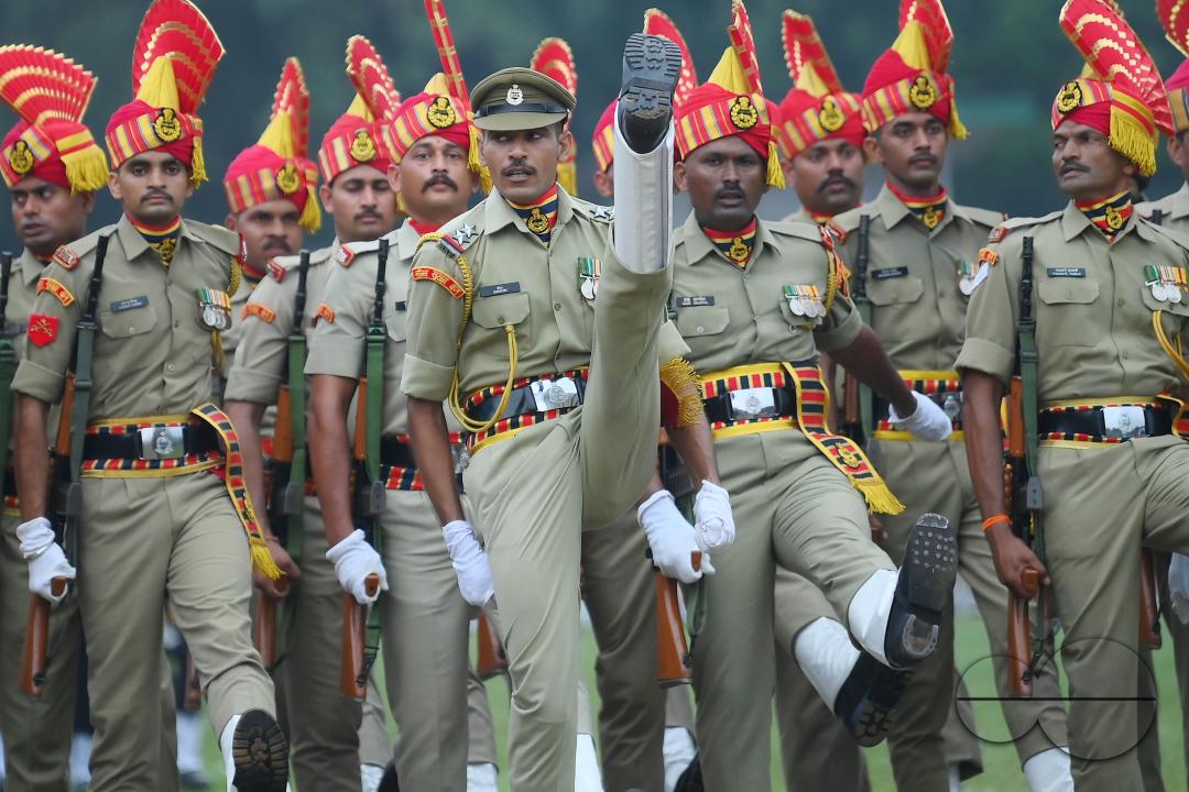 Soldiers of different platoons at the 77th Independence Day parade at the Assam Rifles ground in Agartala