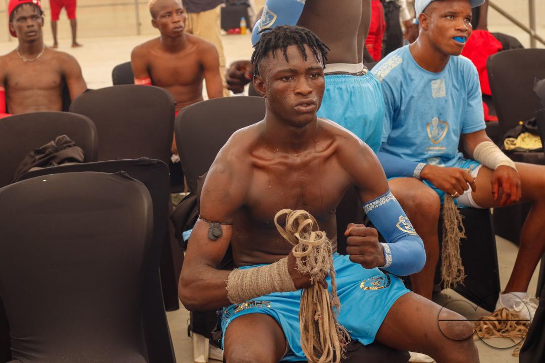 People watch Dambe boxers fight during the Dambe Warriors Supper fight 3 Tournament in Abuja, Nigeria.
