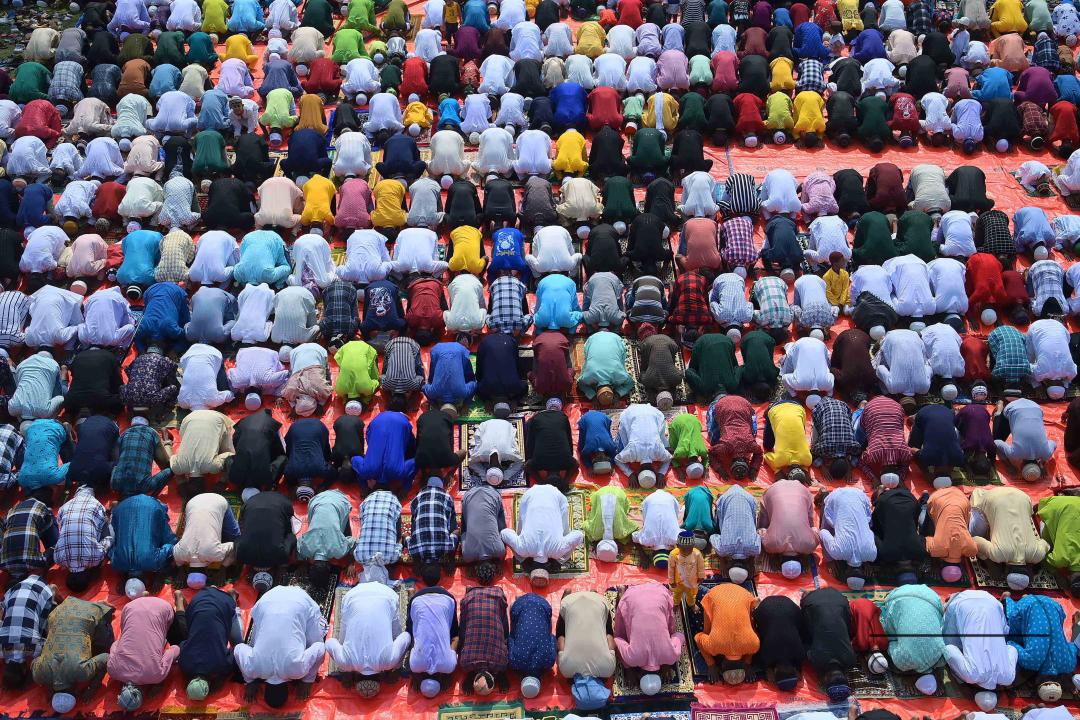 Devotees celebrate Eid-ul-Fitr with prayers ("Namaz") at a mosque in Agartala