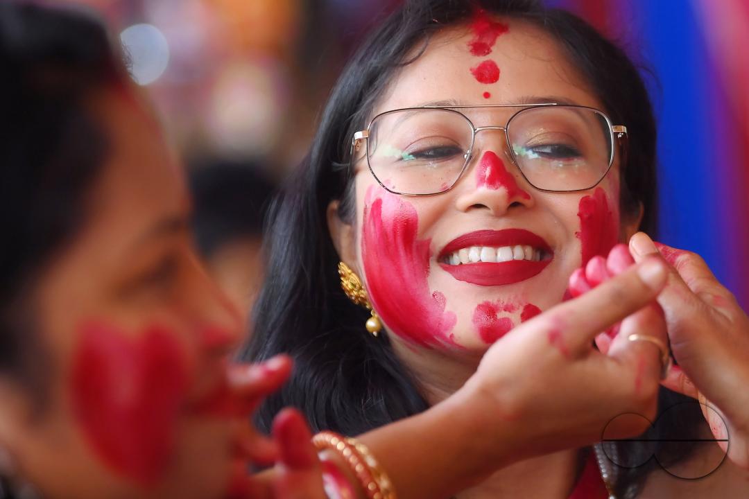 Married ladies smear red Sindoor or Vermillion, a ritual known as Sindur Khela or Vermillion Game on Vijayadashami, the last day of the Durga Puja festival