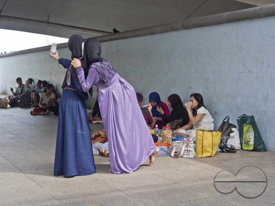 Migrant domestic workers enjoy a day off by the Bay side in Singapore