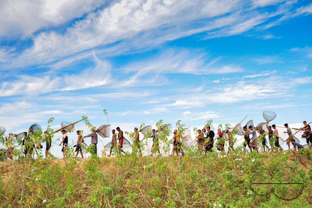 Rural people armed with Bamboo fish traps and nets take part in celebrating a 200-year winter fishing festival at the jofra beel of gasbari union of Kanaighat upazila of Sylhet, Bangladesh.