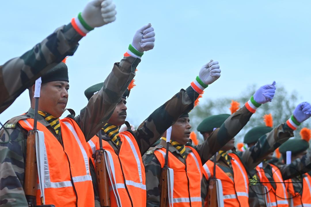 Troopers from the NDRF, Home Guards and Civil Defence take oath on the 61st All India Civil Defence and Home guards raising day at the police parade ground in Agartala