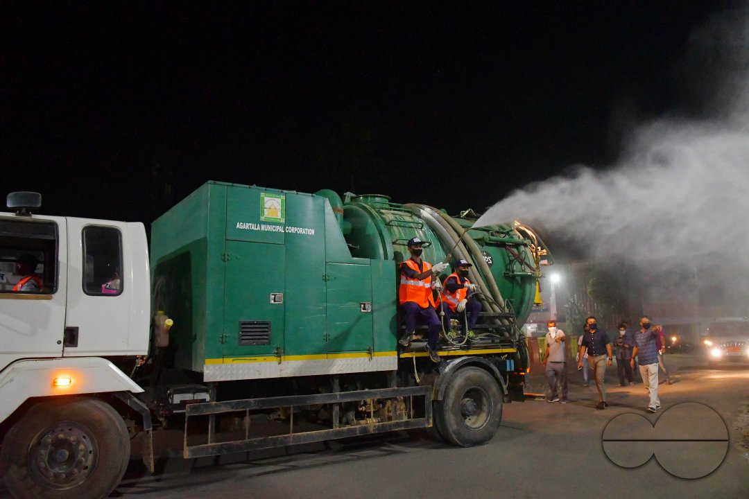 Workers Spray Disinfectant to Contain Coronavirus
