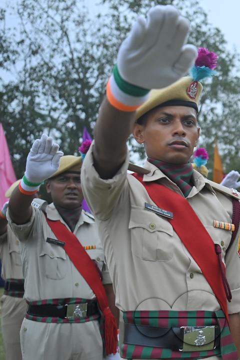 Troopers from the NDRF, Home Guards and Civil Defence take oath on the 61st All India Civil Defence and Home guards raising day at the police parade ground in Agartala