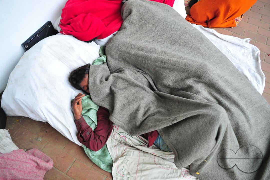 Covering their bodies from head to toe with whatever they can manage, homeless people sleep out in the open in the shivering cold near the Government Alia Madrasa in Sylhet city's Chowhatta area