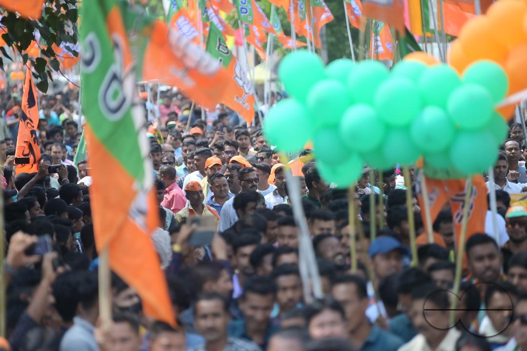BJP supporters seen in a rally with Tripura Chief Minister Manik Saha, former CM and BJP candidate Biplab Kumar Deb, and Kriti Singh along with other leaders during an election campaign rally in support of Lok Sabha candidates at Agartala