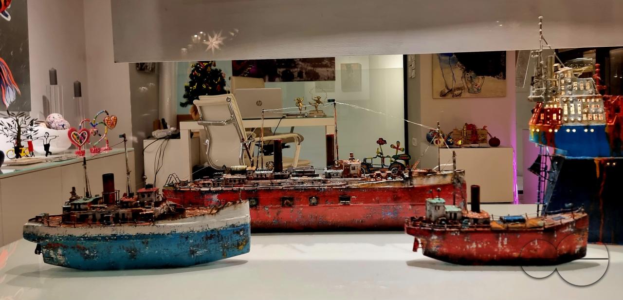 Artefacts including temple replicas, ships, carpets, and local produce are displayed in the old quarters of Athens