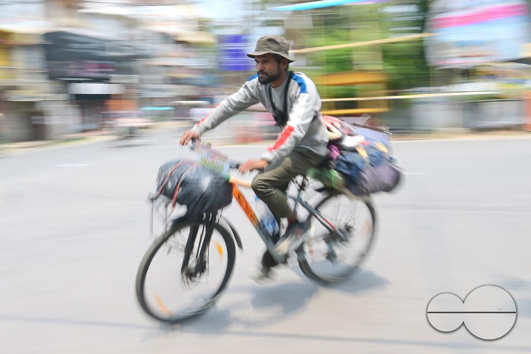Sampoorn Shukla, a 23-year old Radio Jockey from Ashiyana, Lucknow, seen riding a bicycle during his India tour with the theme âJoin humanity save nature," in Agartala