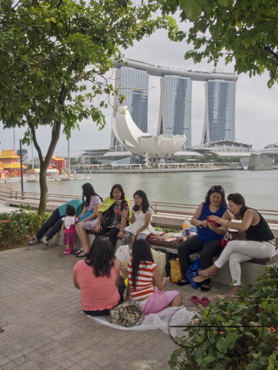 Migrant domestic workers enjoy a day off by the Bay side in Singapore