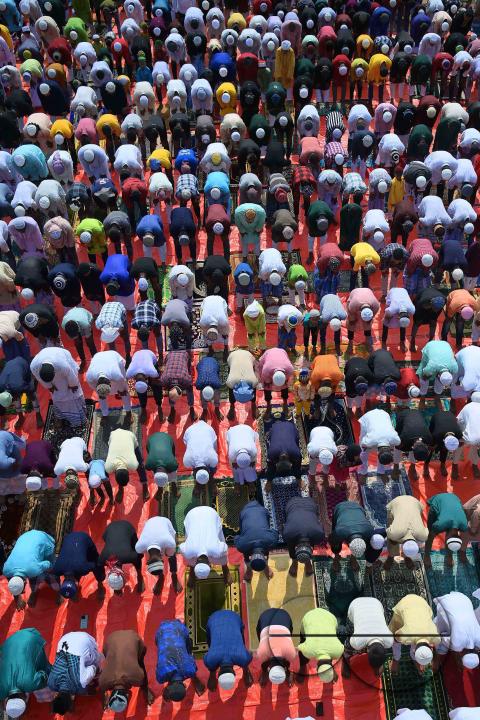Devotees celebrate Eid-ul-Fitr with prayers ("Namaz") at a mosque in Agartala