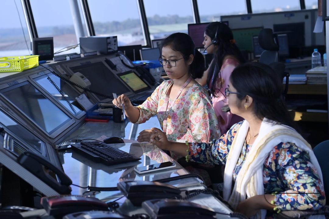 Female traffic controllers, Bipasha Hrangkhawl, Disha Chandra, and Chaya, take charge of traffic management at the Agartala airport's ATCT Tower to celebrate International Women's Day