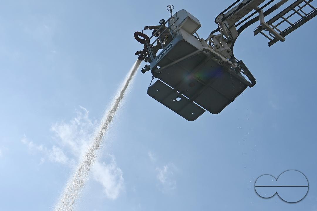Fire brigade personnel are trying to control a fire on the top of the building of the dental college during a state level mock exercise on earthquake day at Agartala