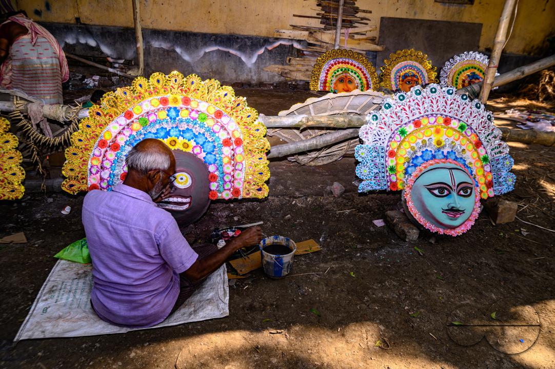 A village idol artist makes large color masks modeled after Purulia Chhau dance masks (Purulia Chhau dance is listed on UNESCO's World Heritage list of dances) of goddesses, animals, and rakshasas (humanoid demons or unrighteous spirits) like Hindu mytho