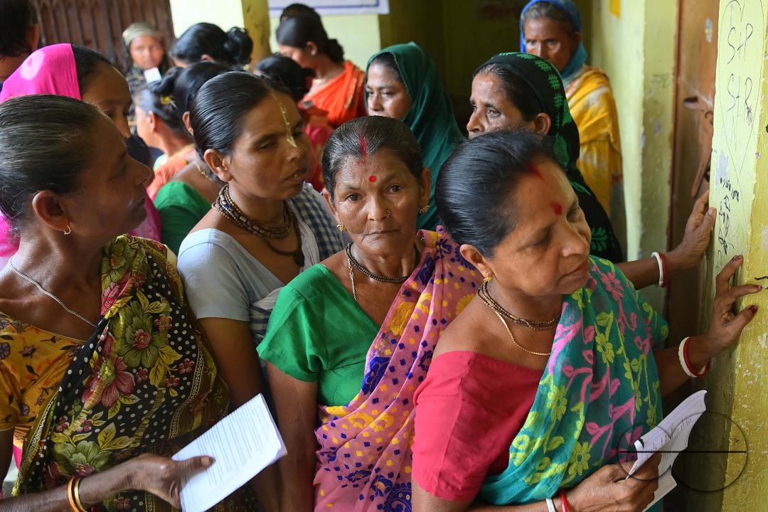 Voters queue up at a Sonamura polling station in Agartala for the Lok Sabha elections