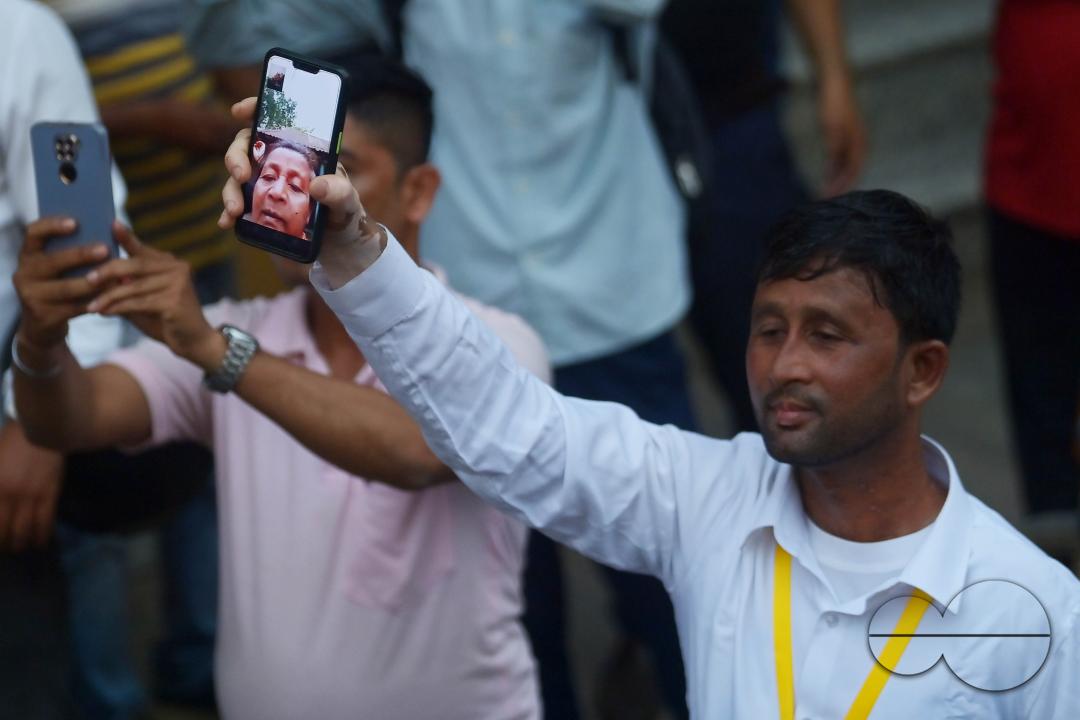 An endearing sight unfolds in Agartala as a supporter shares the live moment of Congress leaders Priyanka Gandhi Vadra, Sudip Roy Barman, and Ashish Sahain through his phone camera with his mother during a lively roadshow preceding the Lok Sabha election