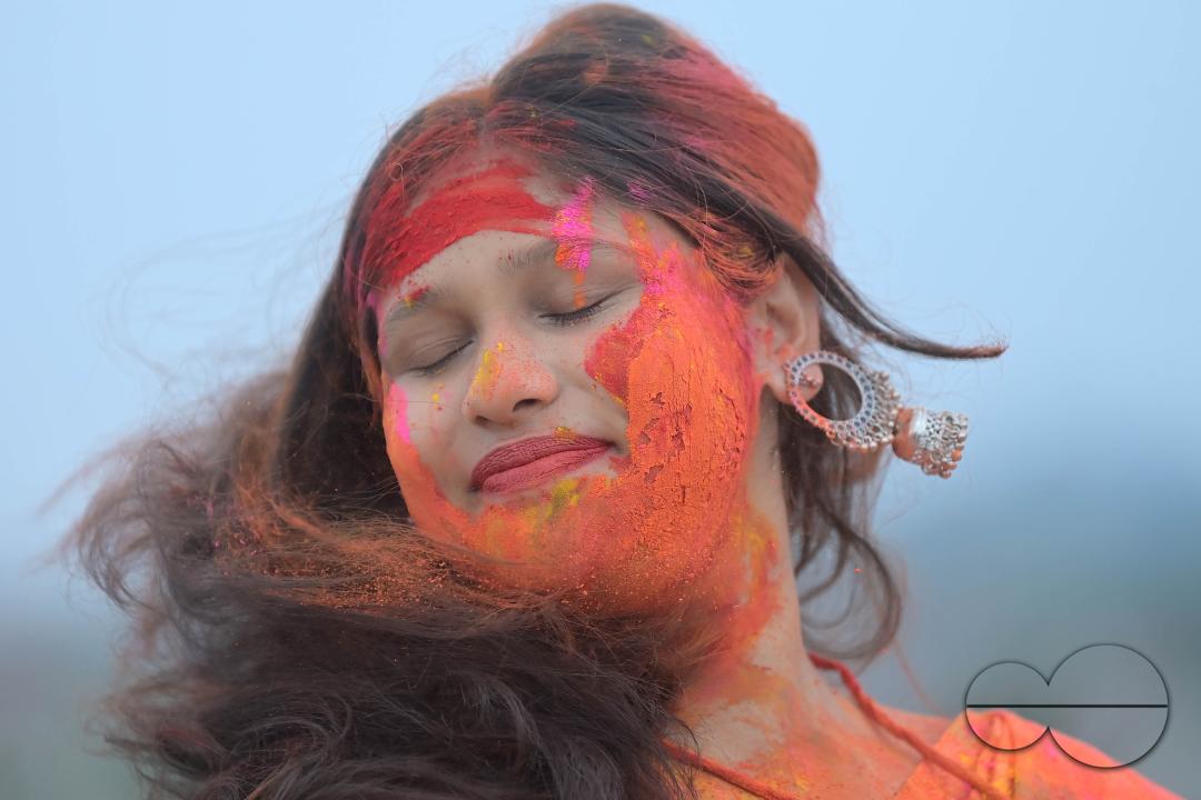 Indian girls adorned with 'Gulal' or coloured powder during the Hindu spring festival 'Holi', the festival of colour in Agartala