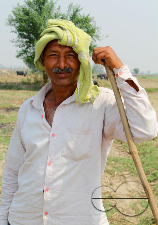 Portrait of a farmer during a hard day's work at a rural village