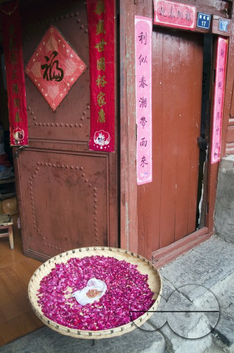 CHINA Flower petals drying in the sun in a village  in Fujian province.