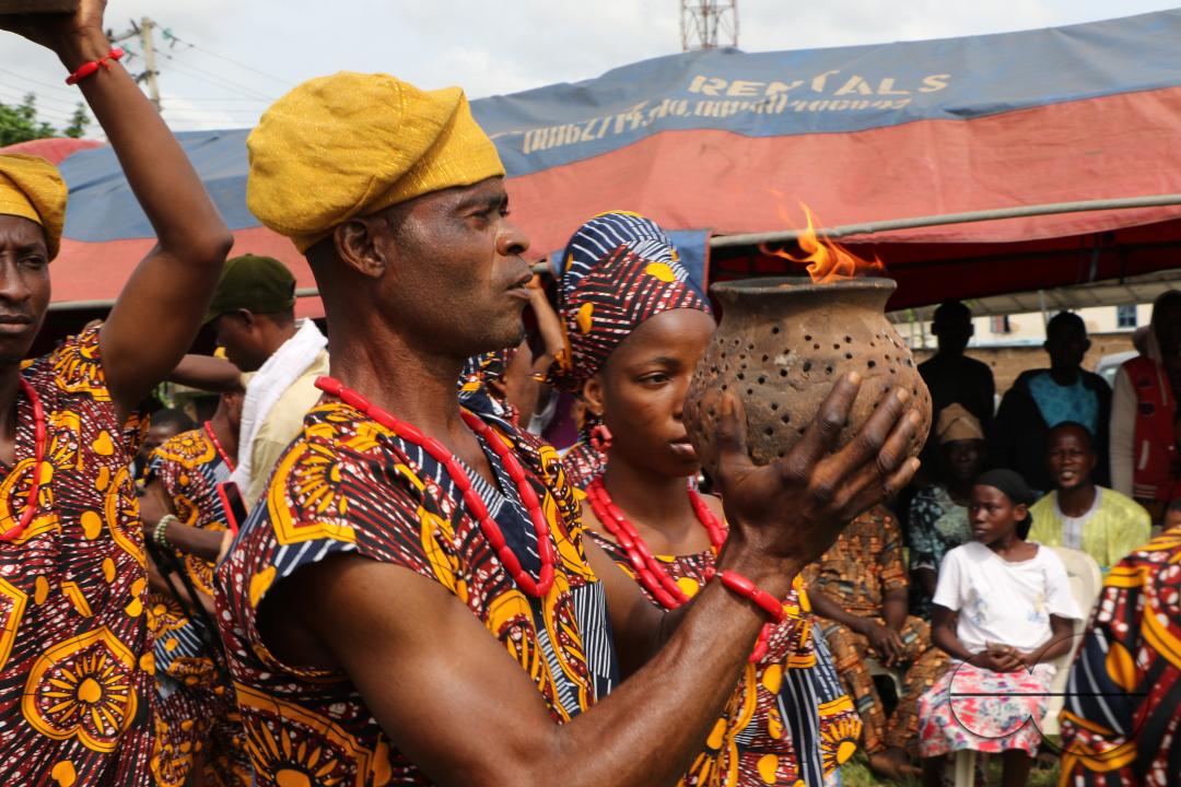 Cultural troupe display, a burning fire from a clay pot at the World Sango Festival which is an annual festival held among the Yoruba people in honor of Sango, a thunder and fire deity who was a warrior and the third king of the Oyo Empire after succeedi