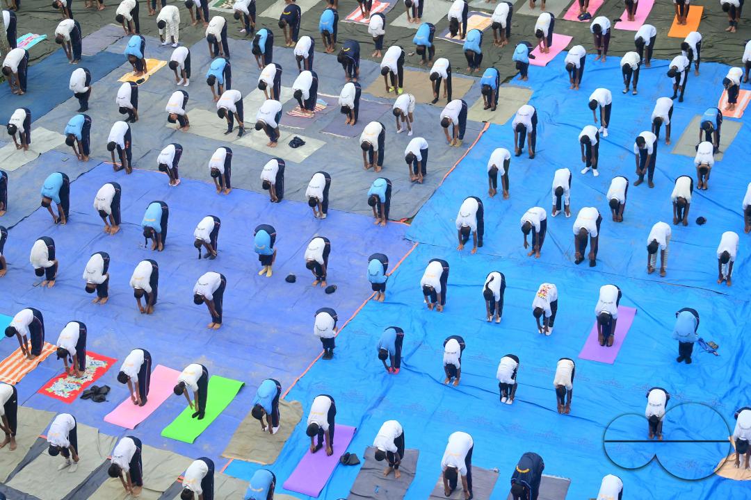NCC cadets and officials perform yoga during 10th International Day of Yoga Day at BBM College Ground in Agartala