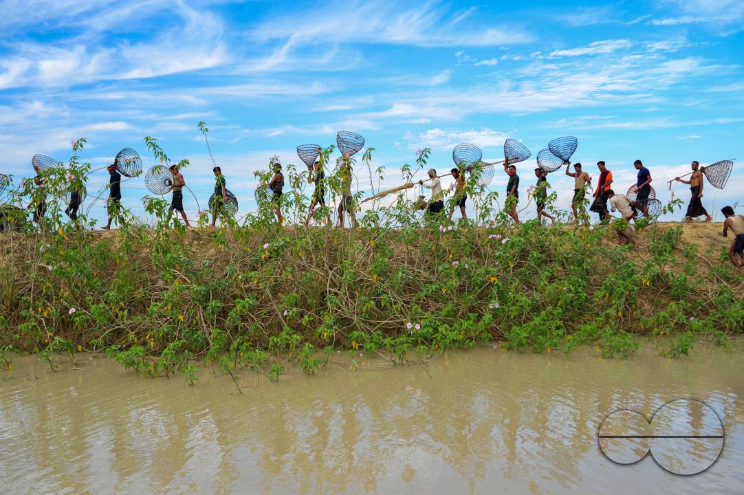 Rural people armed with Bamboo fish traps and nets take part in celebrating a 200-year winter fishing festival at the jofra beel of gasbari union of Kanaighat upazila of Sylhet, Bangladesh.