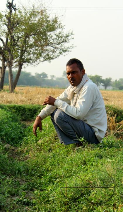 Portrait of a farmer during a hard day's work at a rural village