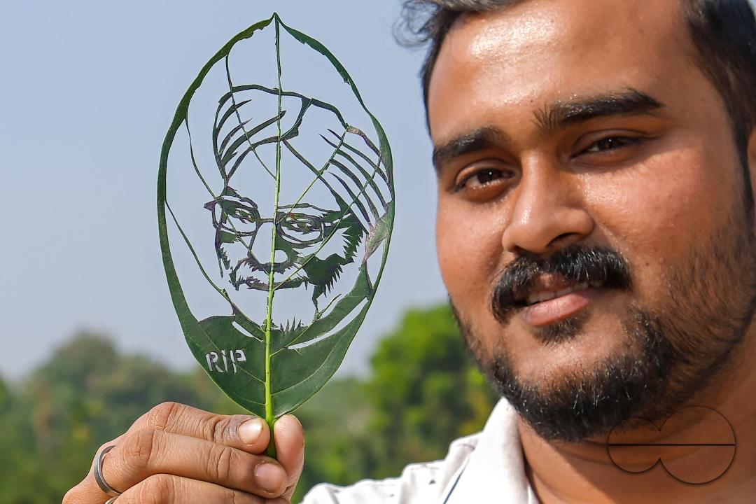 Artist Subham Saha shows his artwork, paying tribute to former prime minister Manmohan Singh, who passed away recently