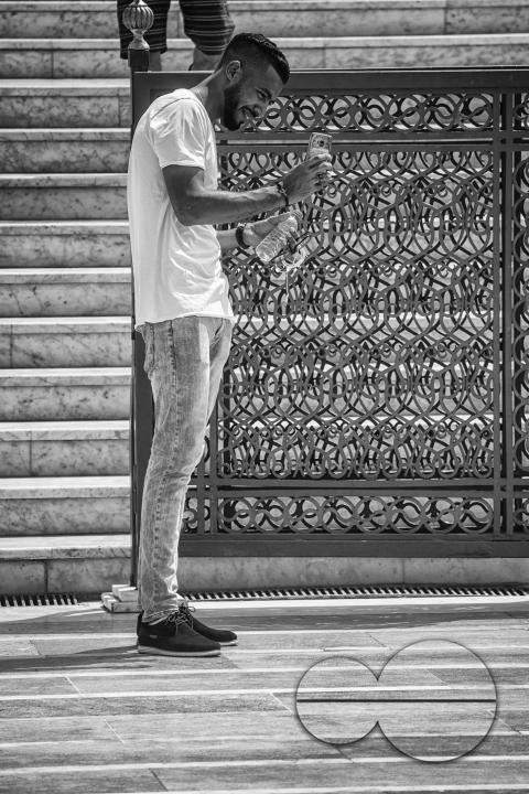 Tourists exploring the historic site of Hassan Tower