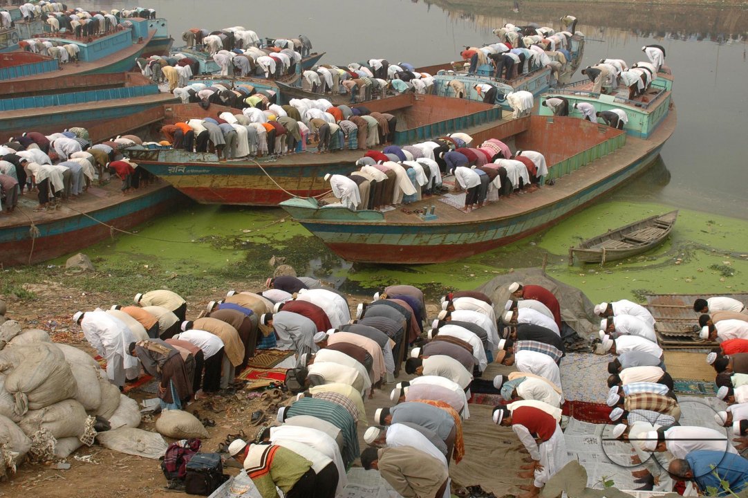 Pilgrims flow into the bank of Turag