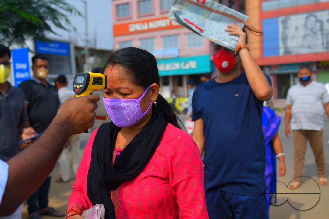 The health workers are applying infrared thermometer to check the temperatures