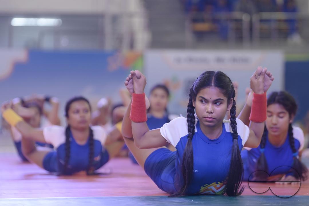 Students of Kalyani University in Orissa perform Yoga at the Khelo India University Games competition