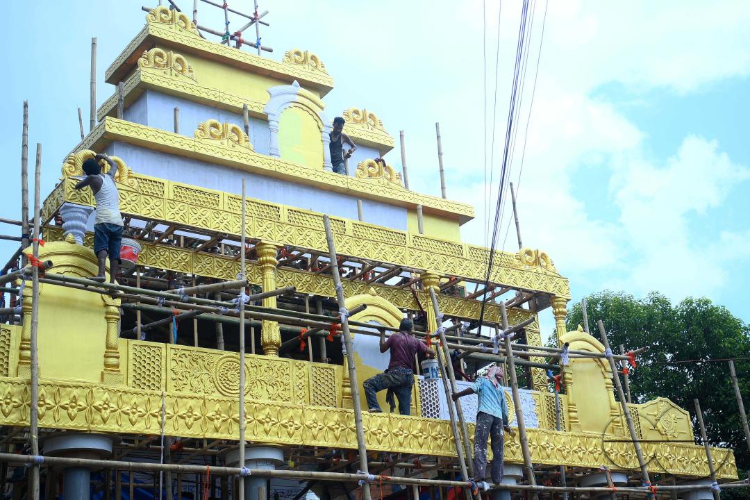 Workers are making a pandal, a temporary structure set up to usually venerate the God and Goddess, ahead of Ganesh Chaturthi festival in Agartala