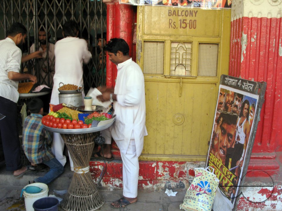 INDIA.People buying snacks during an interval in an old picture house in Mumbai.