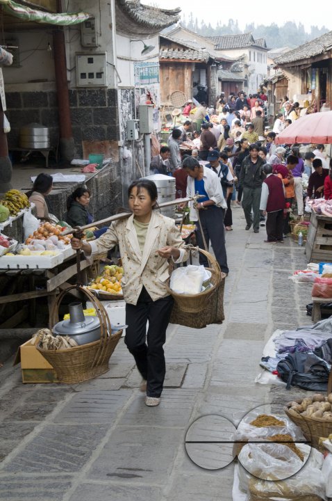 CHINA Vendors at the market place in a village in Yunnan province.