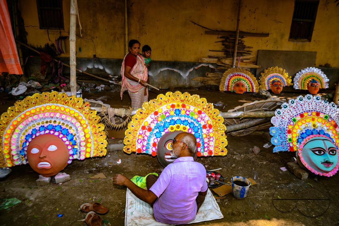 A village idol artist makes large color masks modeled after Purulia Chhau dance masks (Purulia Chhau dance is listed on UNESCO's World Heritage list of dances) of goddesses, animals, and rakshasas (humanoid demons or unrighteous spirits) like Hindu mytho