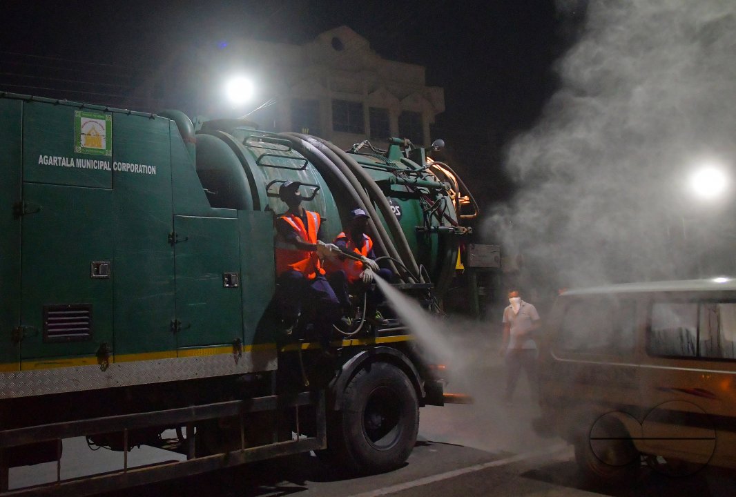 Workers Spray Disinfectant to Contain Coronavirus